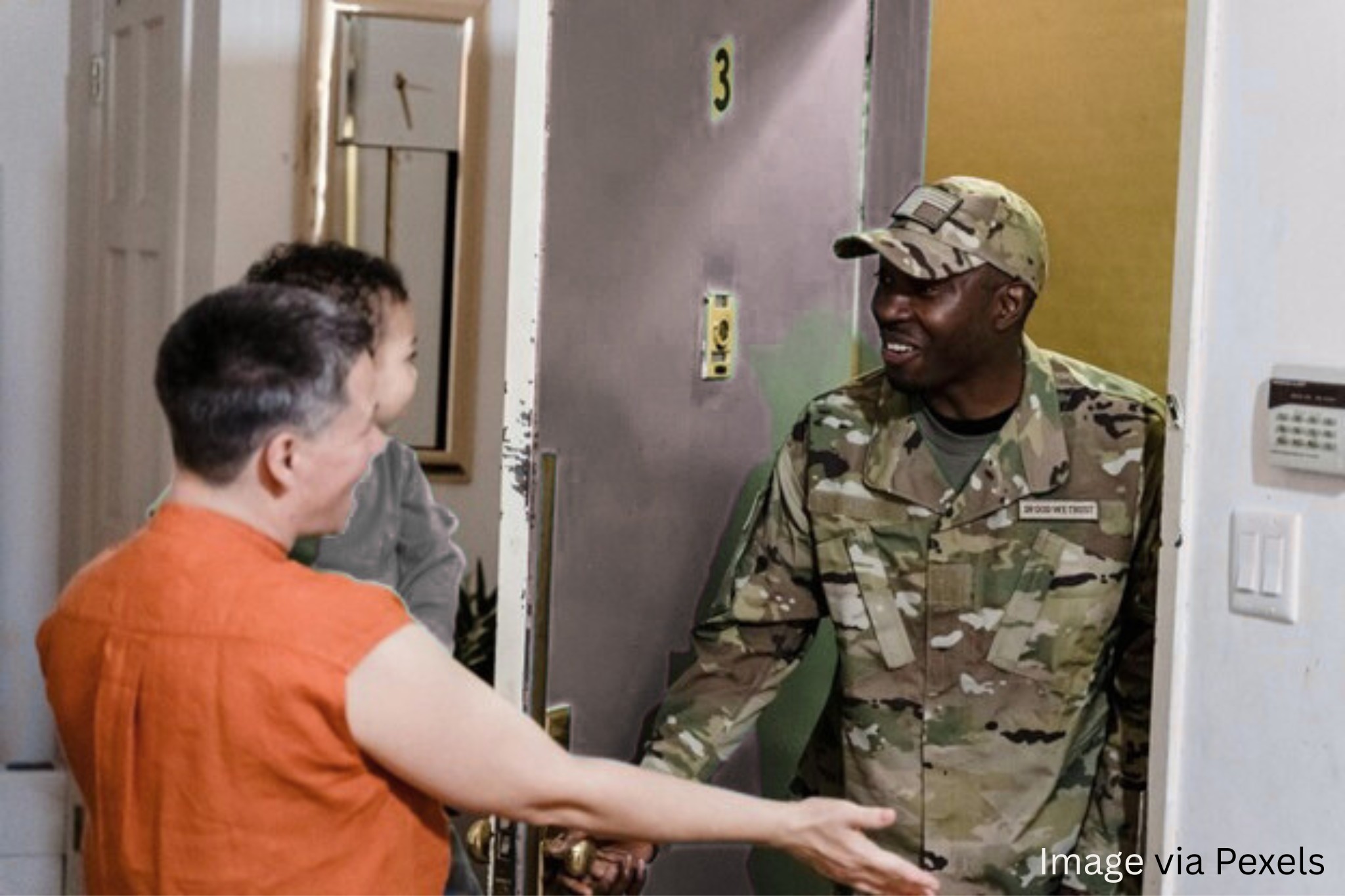 Veteran's greeting each other at the door.